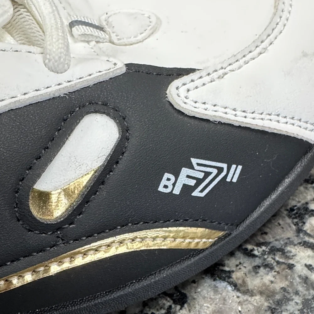 White and Black womens fashion Sneakers with gold accents EUC 10